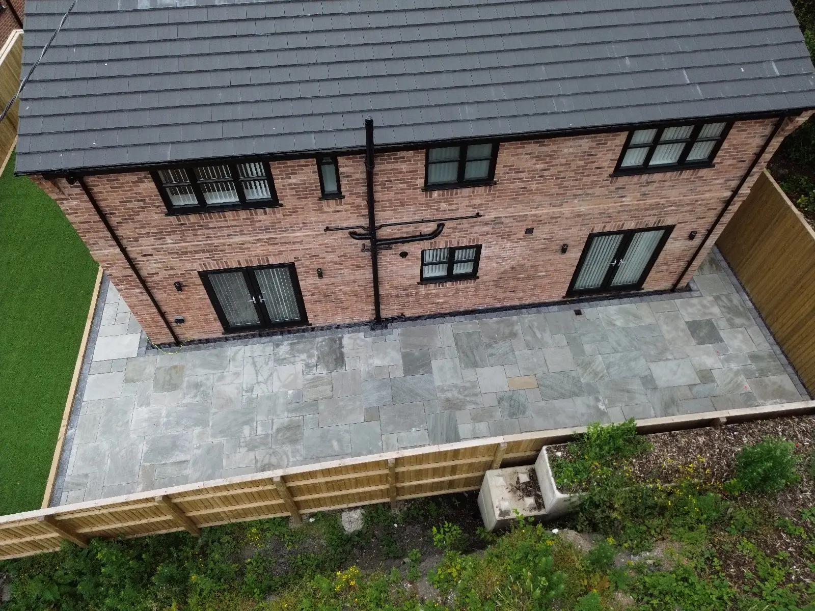 image of a house with newly fitted grey black upvc windows