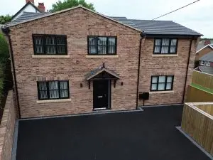 image of a house with new windows and doors in dark grey