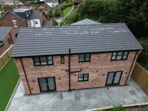 image of a house with newly installed dark grey windows