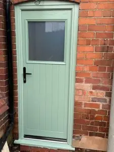image of a new composite entrance door in green